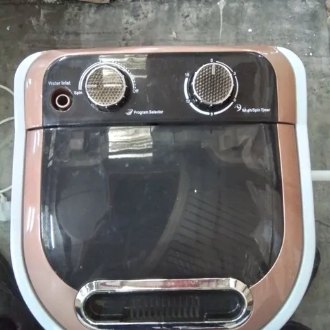 A BOXED COUNTER TOP MINI WASHING MACHINE
