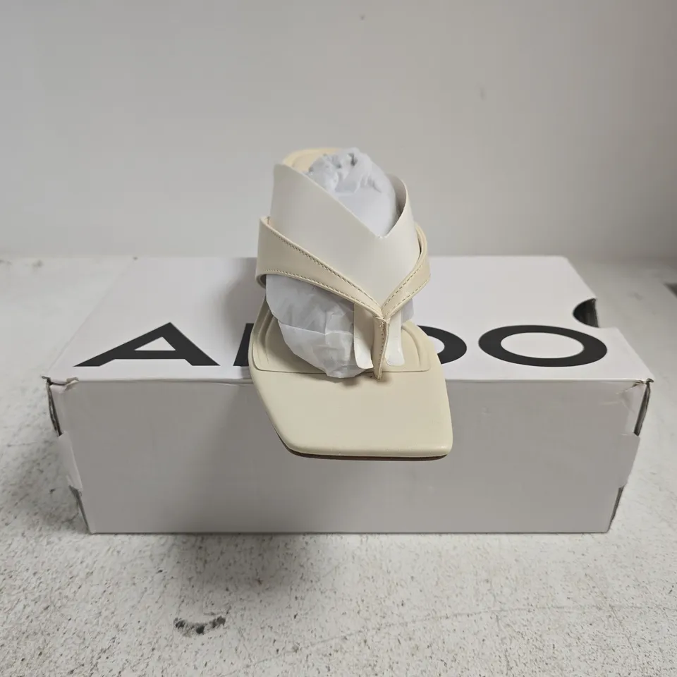 BOXED PAIR OF ALDO TOE-POST BLOCK HEEL SANDALS IN CREAM SIZE 8