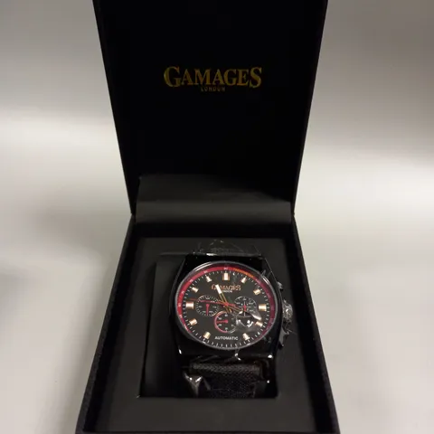 BOXED GAMAGES RETRO CALIBRE BLACK TRIPLE DATE DIAL AUTOMATIC TACHYMETER LEATHER STRAP WRISTWATCH	