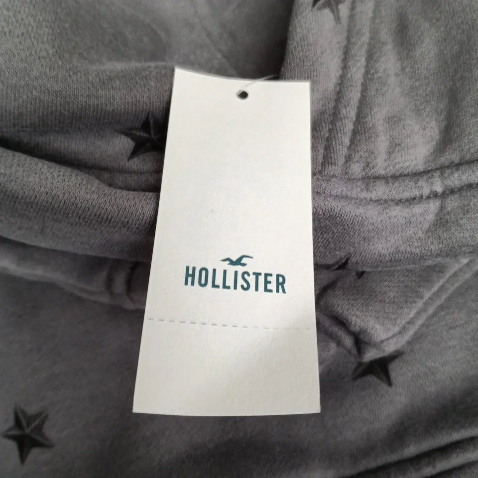 HOLLISTER HOODIE – GREY STAR PRINT – LARGE