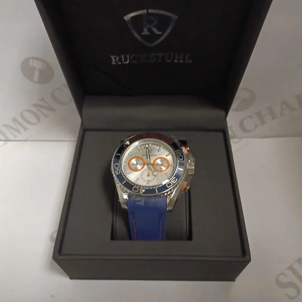 MEN’S RUCKSTUHL CHRONOGRAPH R400 WATCH – SILVER COLOUR CASE – SILVER DIAL – 3ATM WATER RESISTANT – BLUE RUBBER STRAP 