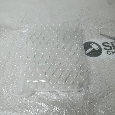 BAG OF SMALL GLASS CONTAINERS AND CORK LIDS