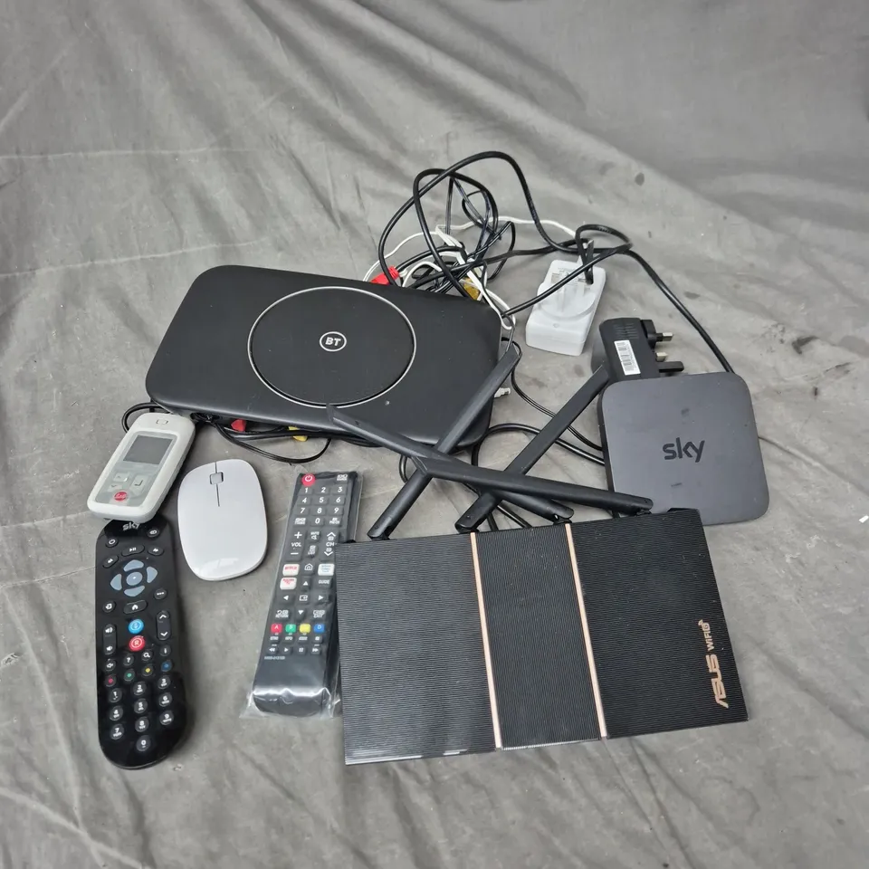 TOTE OF APPROXIMATELY 12 ASSORTED ELECTRICAL PRODUCTS TO INCLUDE - ROUTERS - REMOTES - MOUSE - ETC