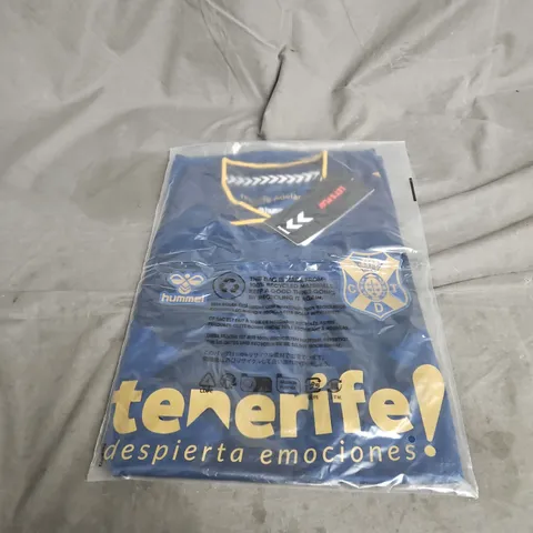 BAGGED HUMMEL TENERIFE COT GOLDEN LAND SHORT SLEEVE JERSEY IN BLUE MIX SIZE M
