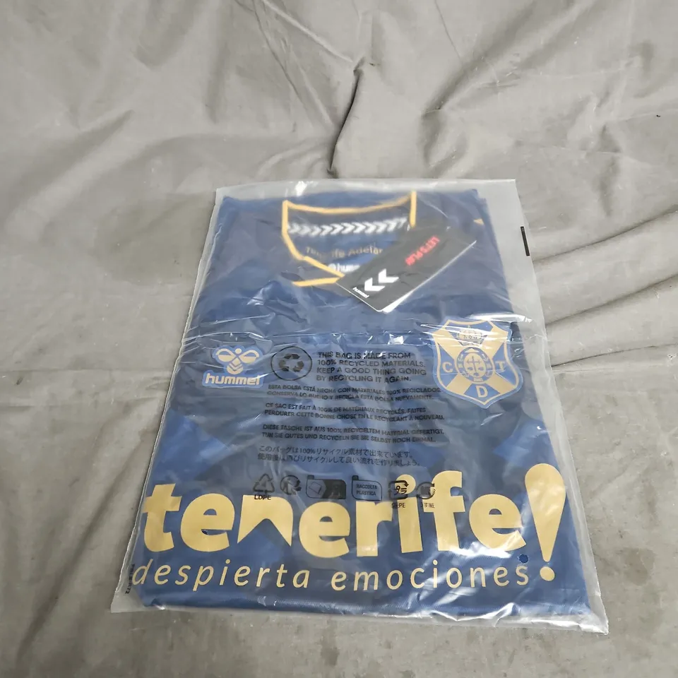 BAGGED HUMMEL TENERIFE COT GOLDEN LAND SHORT SLEEVE JERSEY IN BLUE MIX SIZE M