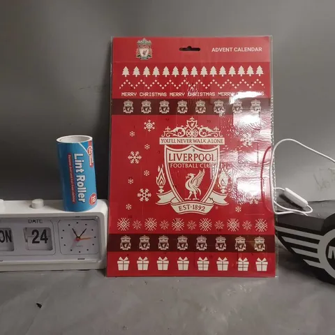 APPROXIMATELY 13 ASSORTED ITEMS TO INCLUDE - LIVERPOOL ADVENT CALENDAR , MINI LIGHT UP BADGE , LINT ROLLER ETC