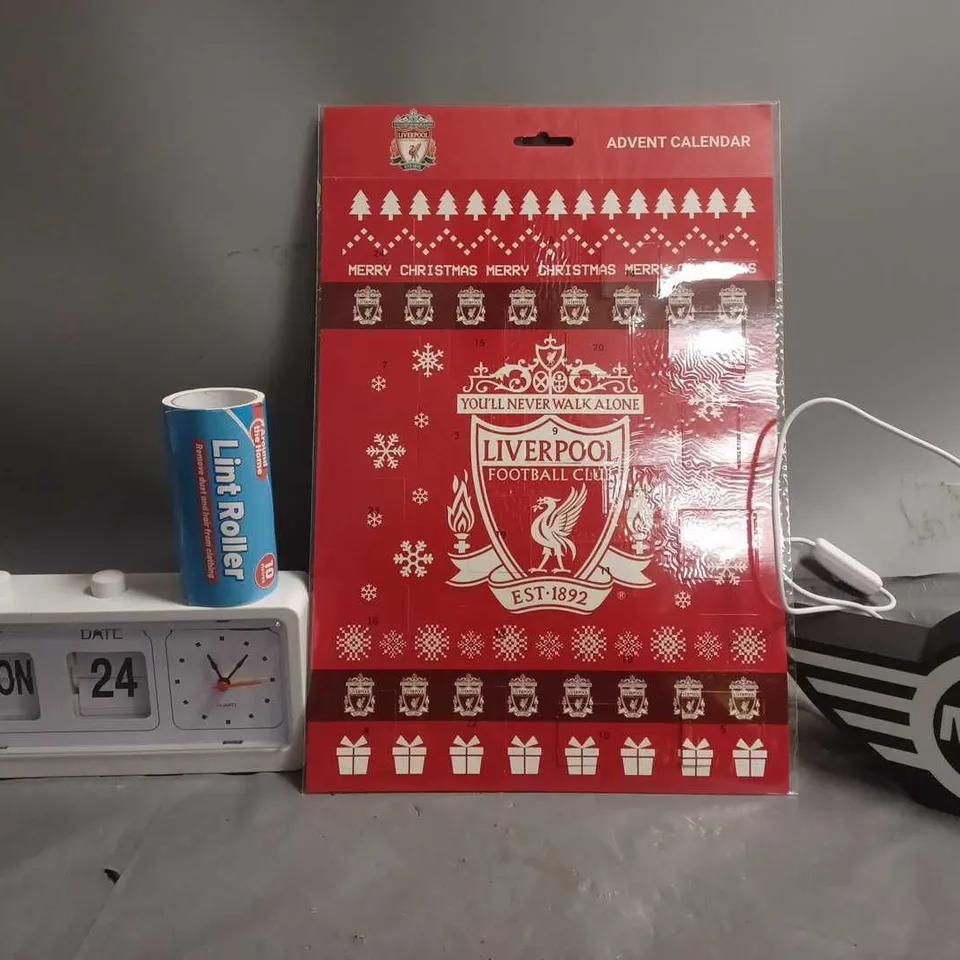 APPROXIMATELY 13 ASSORTED ITEMS TO INCLUDE - LIVERPOOL ADVENT CALENDAR , MINI LIGHT UP BADGE , LINT ROLLER ETC