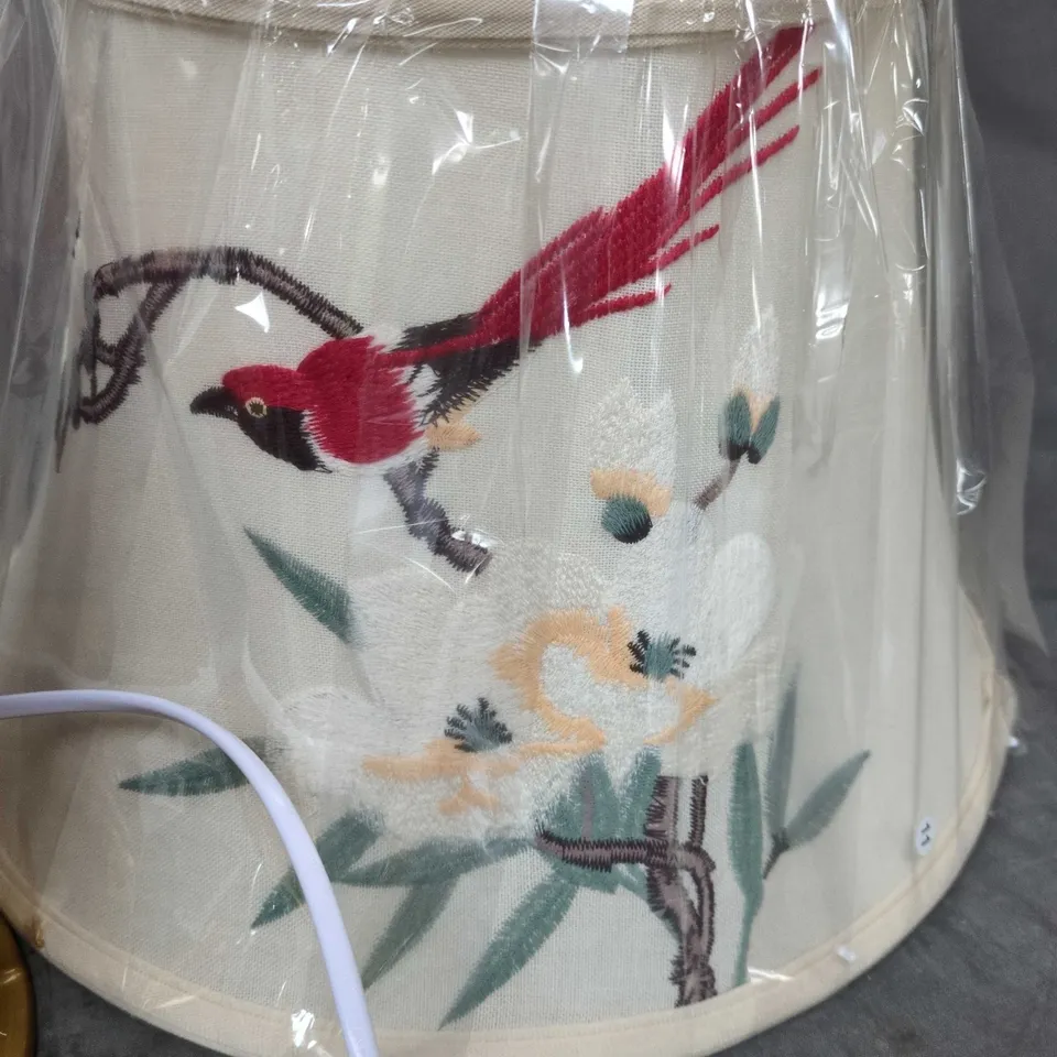 PORCELAIN TABLE LAMP WITH RED GLAZE AND BIRD MOTIF – BRASS EFFECT BASE, EMBROIDERED SHADE INCLUDED