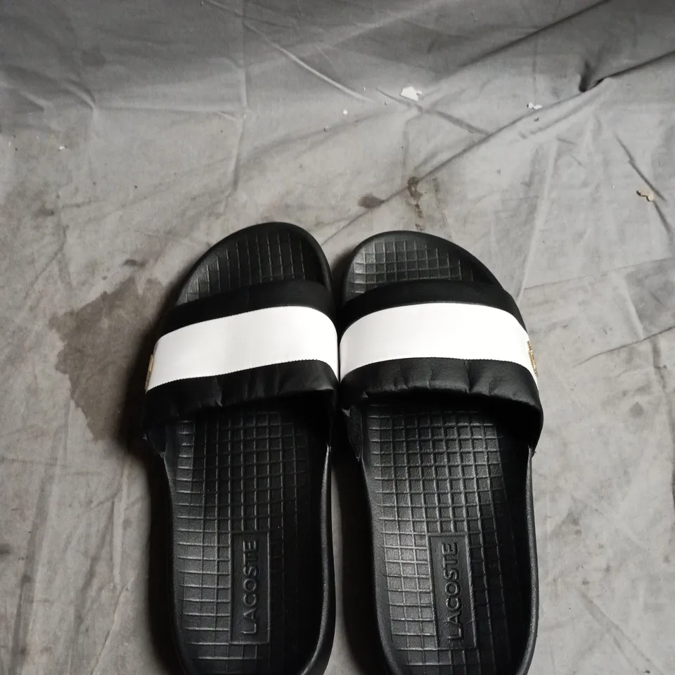 LACOSTE BLACK SLIDES WITH WHITE STRAP – UNISEX UK 11