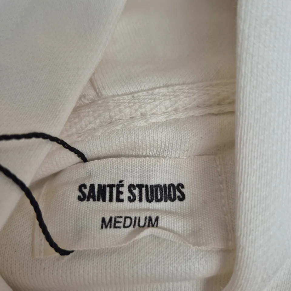 SANTÉ STUDIOS WHITE HOODIE - MEDIUM WITH BACK PRINT 'LE GRAND PRIX DES SPORTS D'HIVER'