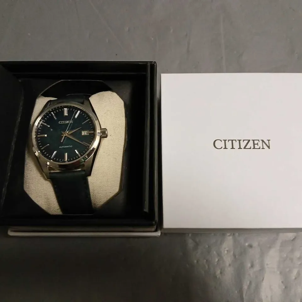 BOXED CITIZEN AUTOMATIC STAINLESS STEEL GENTS WATCH WITH SKELETON BACK AND LEATHER STRAP