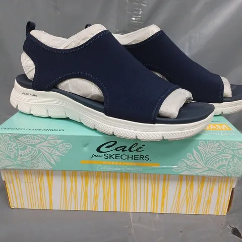 BOXED PAIR OF CALI FROM SKECHERS SANDALS IN NAVY SIZE 8