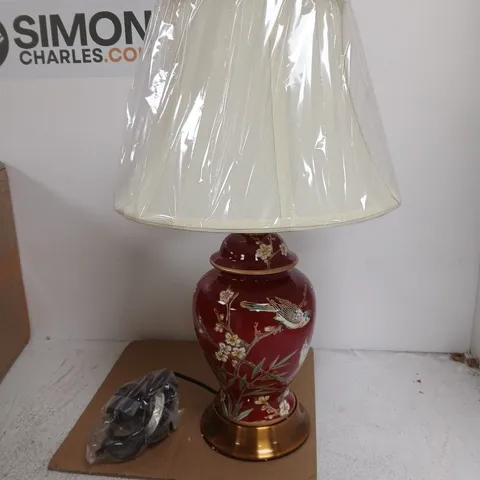 PORCELAIN TABLE LAMP WITH RED GLAZE, BIRD & BLOSSOM MOTIF; BRASS BASE; FABRIC SHADE
