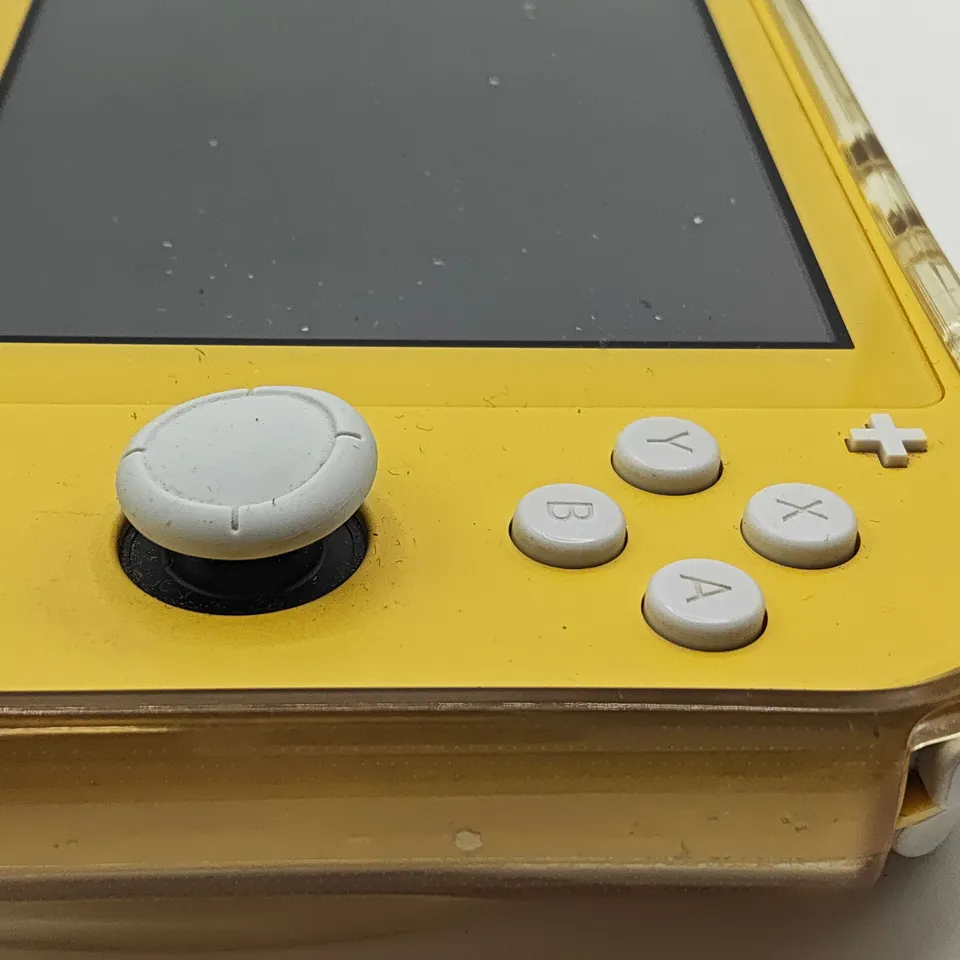 UNBOXED NINTENDO SWITCH LITE IN YELLOW WITH CLEAR CASE - HDH-001