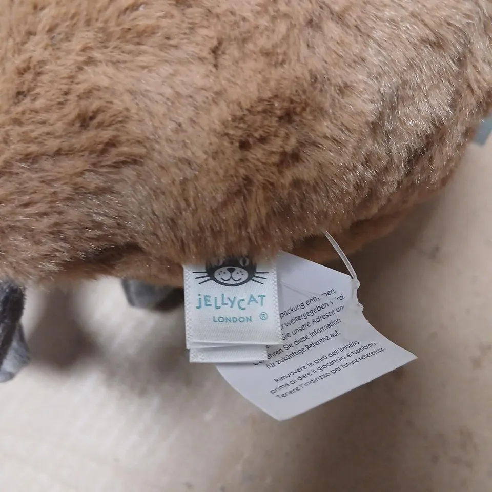 JELLYCAT LONDON PLUSH TOY – BROWN, WITH RED SCARF