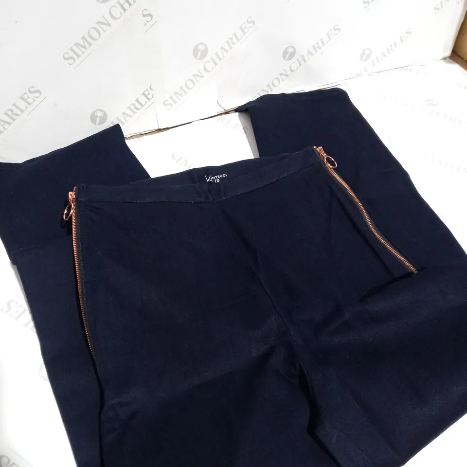 box of clothing items to include jeans, jogging bottoms, tops etc