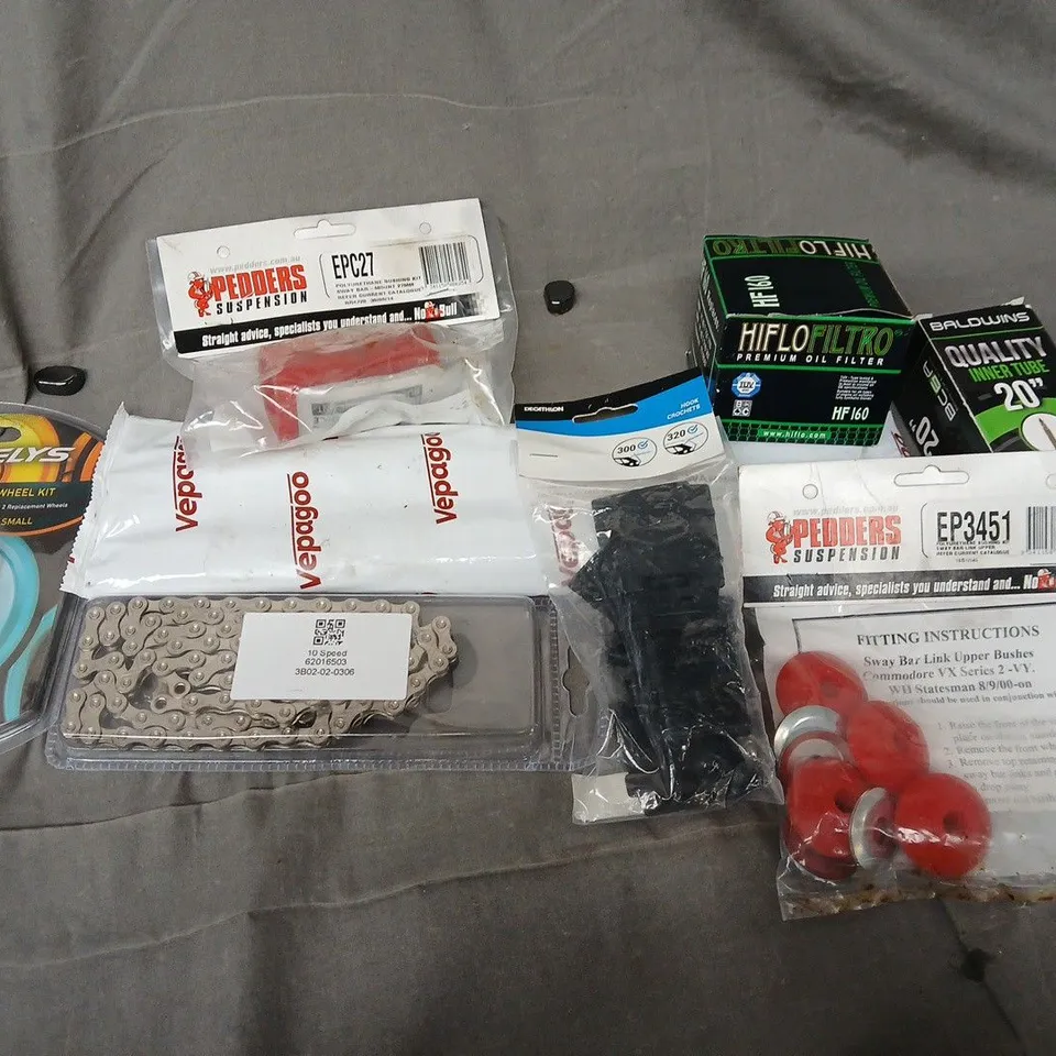 APPROXIMATELY 12 ASSORTED VEHICLE PARTS & ACCESORIES TO INCLUDE OIL FILTER, POLYURETHANE BUSHING KIT, BIKE CHAIN, ETC