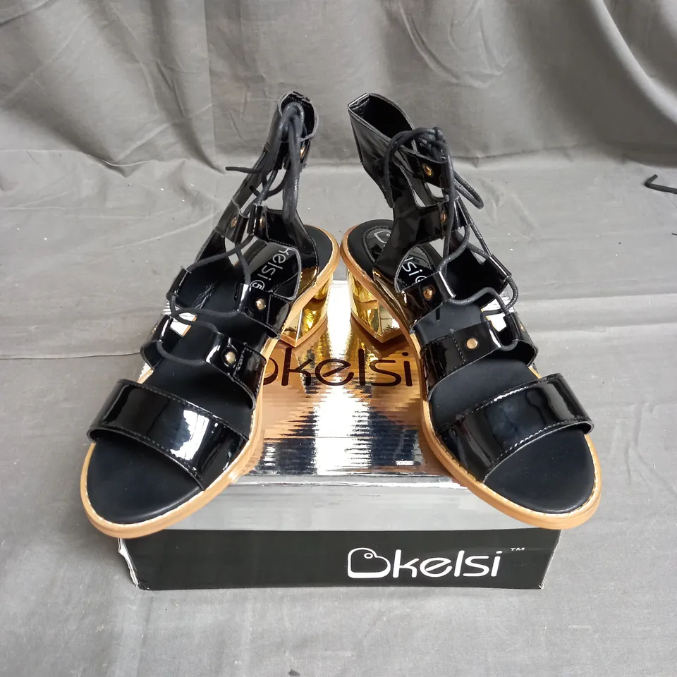 BOX OF APPROXIMATELY 12 PAIRS OF KELSI STRAP HEELED SANDALS IN BLACK  - VARIOUS SIZES