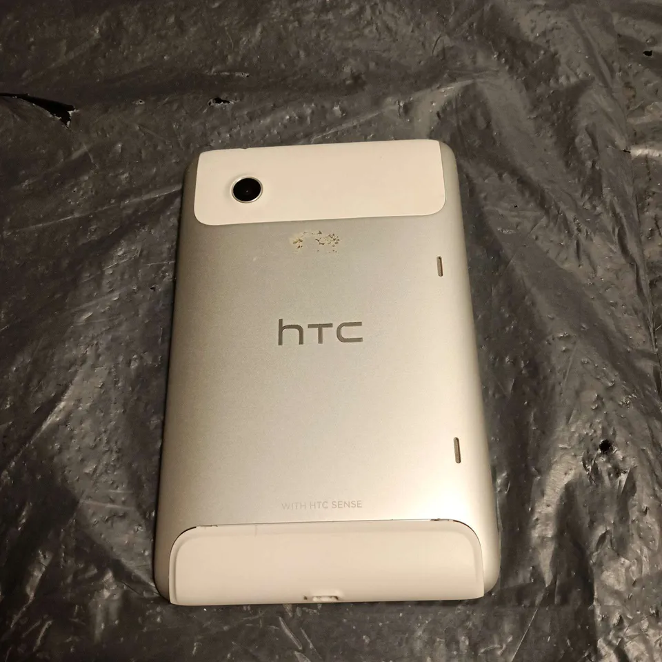 HTC TABLET DEVICE - SILVER BACK WITH 'WITH HTC SENSE' BRANDING