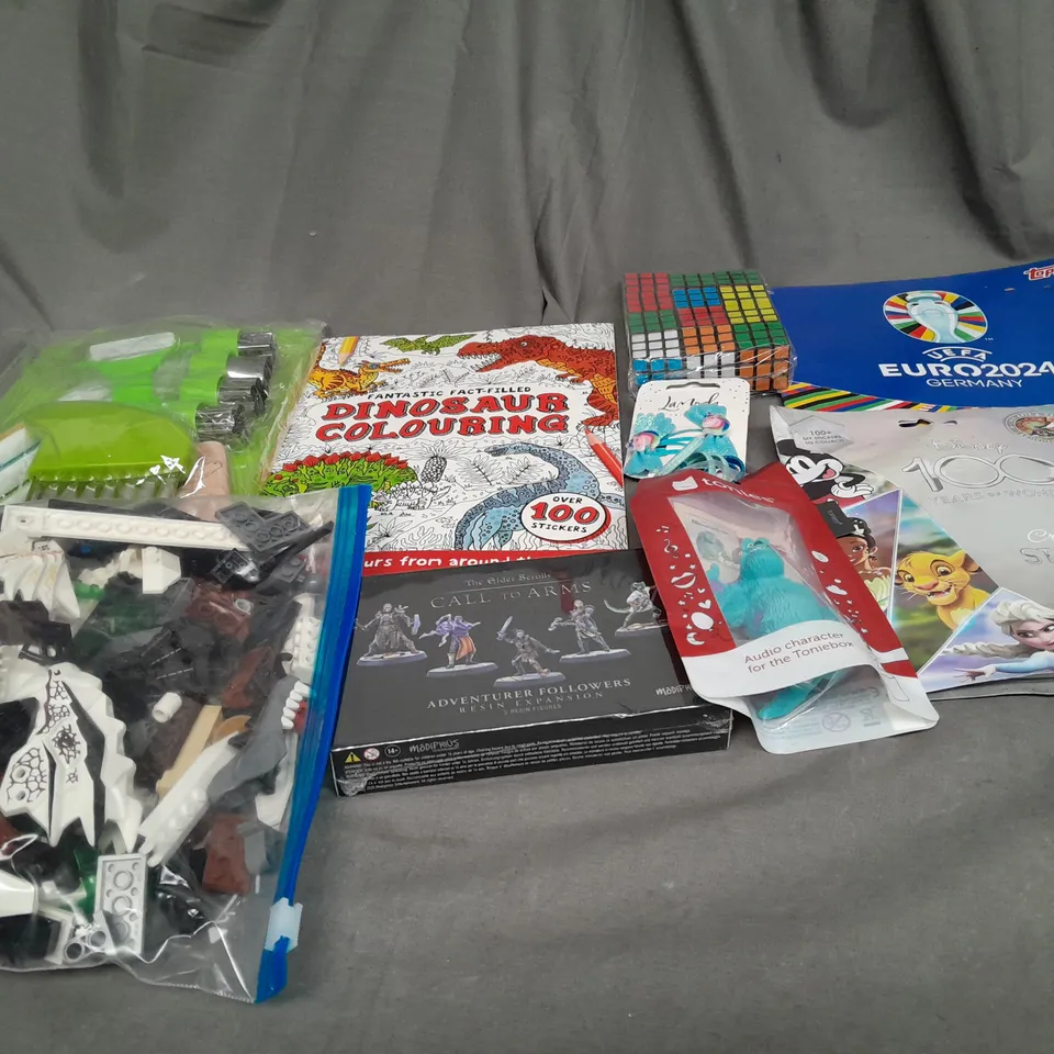 LARGE QAUNTIITY OF ASSORTED TOYS AND GAMES TO INCLUDE STICKER BOOKS, RUBIKS CUBE AND COLOURING BOOKS