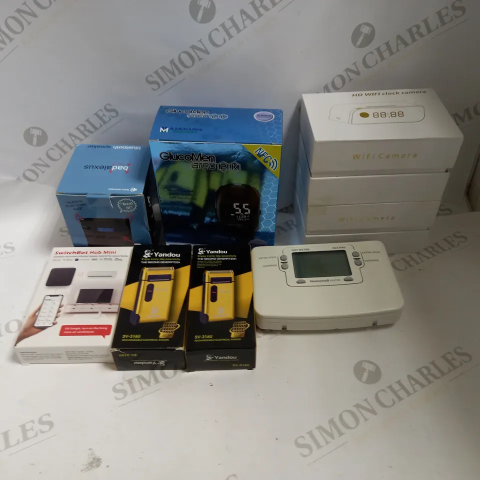 LOT TO CONTAIN APPROX. 8 X ASSORTED ELECTRONIC GOODS, WIFI CAMERAS, SPEAKER, GLUCOSE READER 