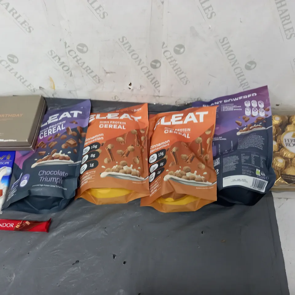 APPROXIMATELY 8 ASSORTED FOOD ITEMS TO INCLUDE - ELEAT PROTEIN CEREAL, HOTLE CHOCOLATE BIRTHDAY COLLECTION, AND FERRERO ROCHER ETC.