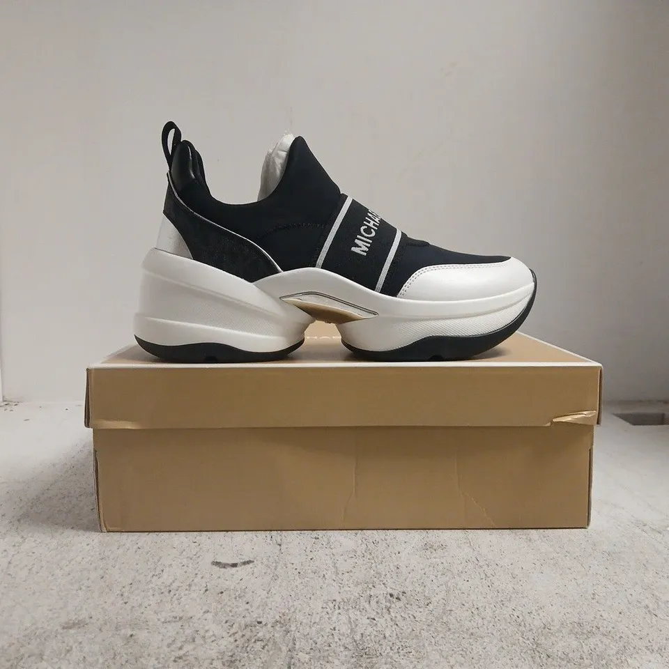 BOXED PAIR OF MICHAEL KORS OLYMPIA SLIP-ON SHOES IN BLACK/WHITE SIZE US 10M