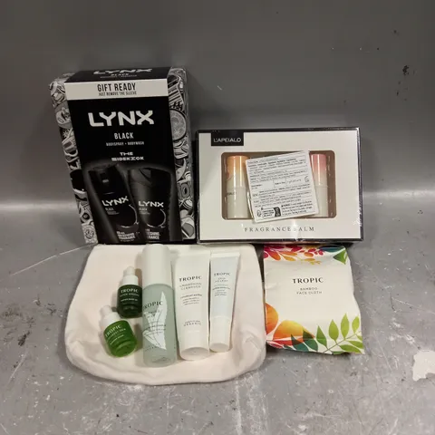 LOT OF 3 ASSORTED COSMETIC BOXSETS TO INCLUDE - LYNX BLACK BODY COLLECTION - L'APEIALO FRAGRANCE BALM TRIO - TROPIC SKINCARE COLLECTION