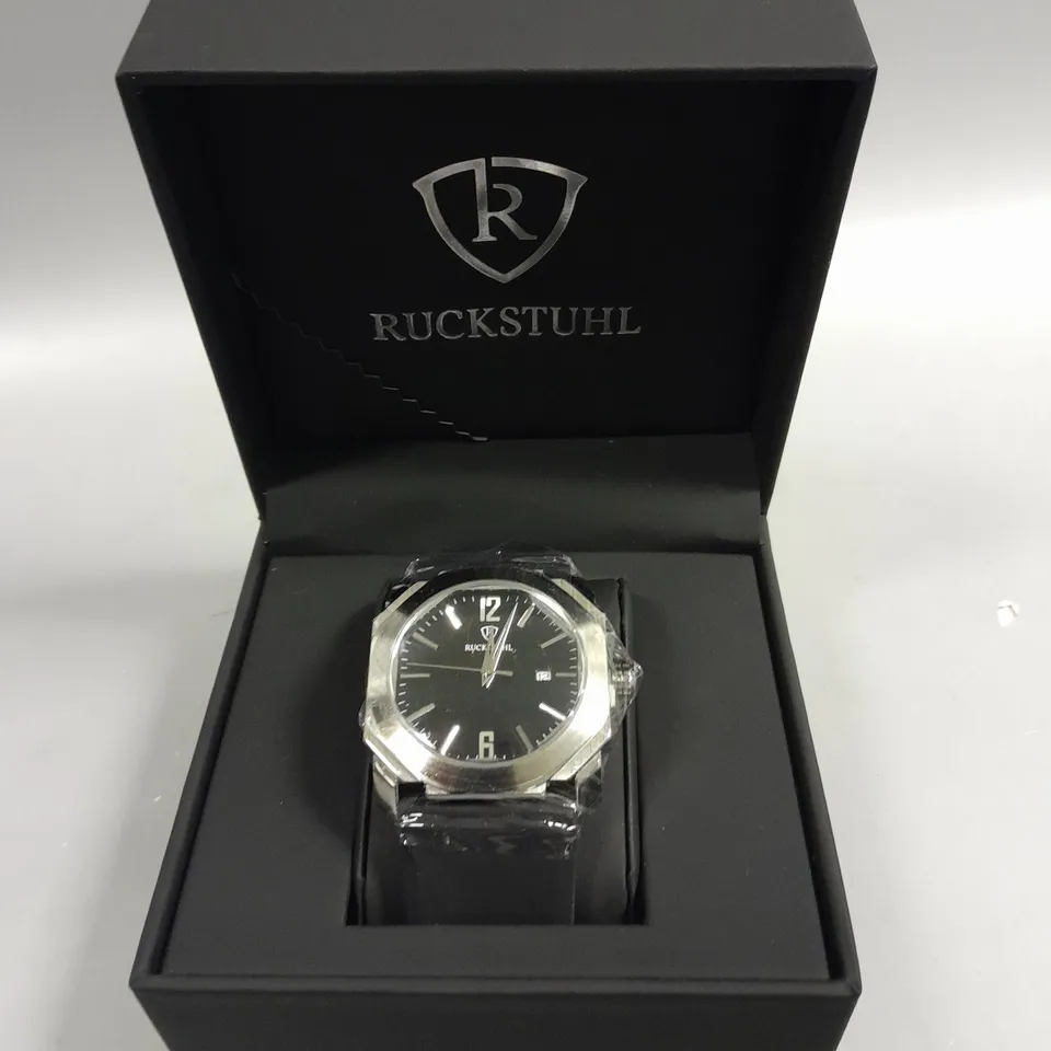 MENS RUCKSTUHL BLACK DIAL WATER RESISTANT WATCH WITH STAINLESS STEEL CASE AND RUBBER STRAP IN GIFT BOX