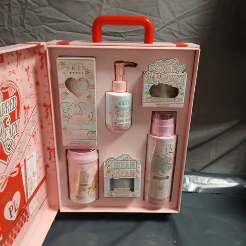 PLOUISE WRAPPED & READY WHEELED SUITCASE BEAUTY GIFT SET