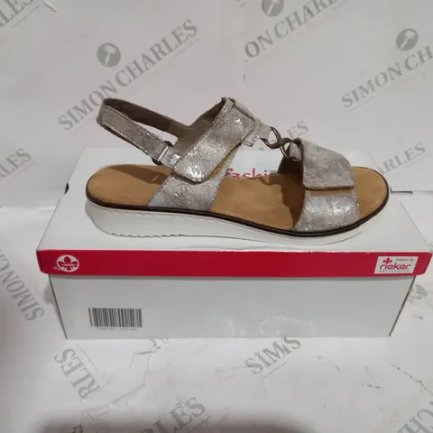 BOXED PAIR OF RIEKER MULTI-STRAP SANDALS IN METALLIC SILVER EU SIZE 39