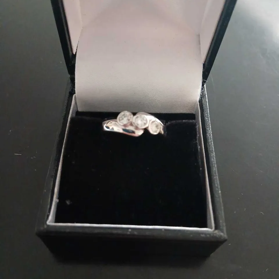 18CT WHITE GOLD THREE STONE RING SET WITH NATURAL DIAMONDS