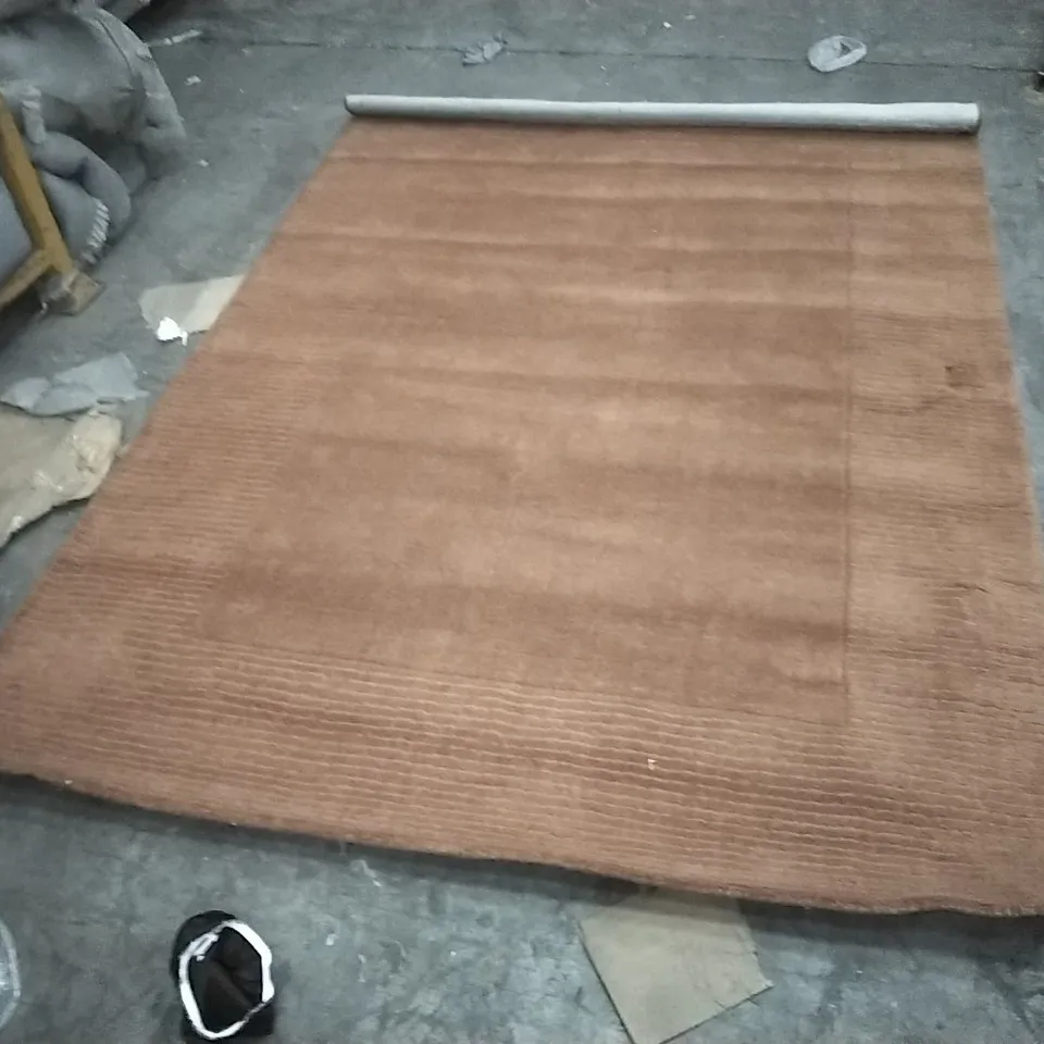 STILLAGE OF APPROXIMATELY 12 DESIGNER RUGS