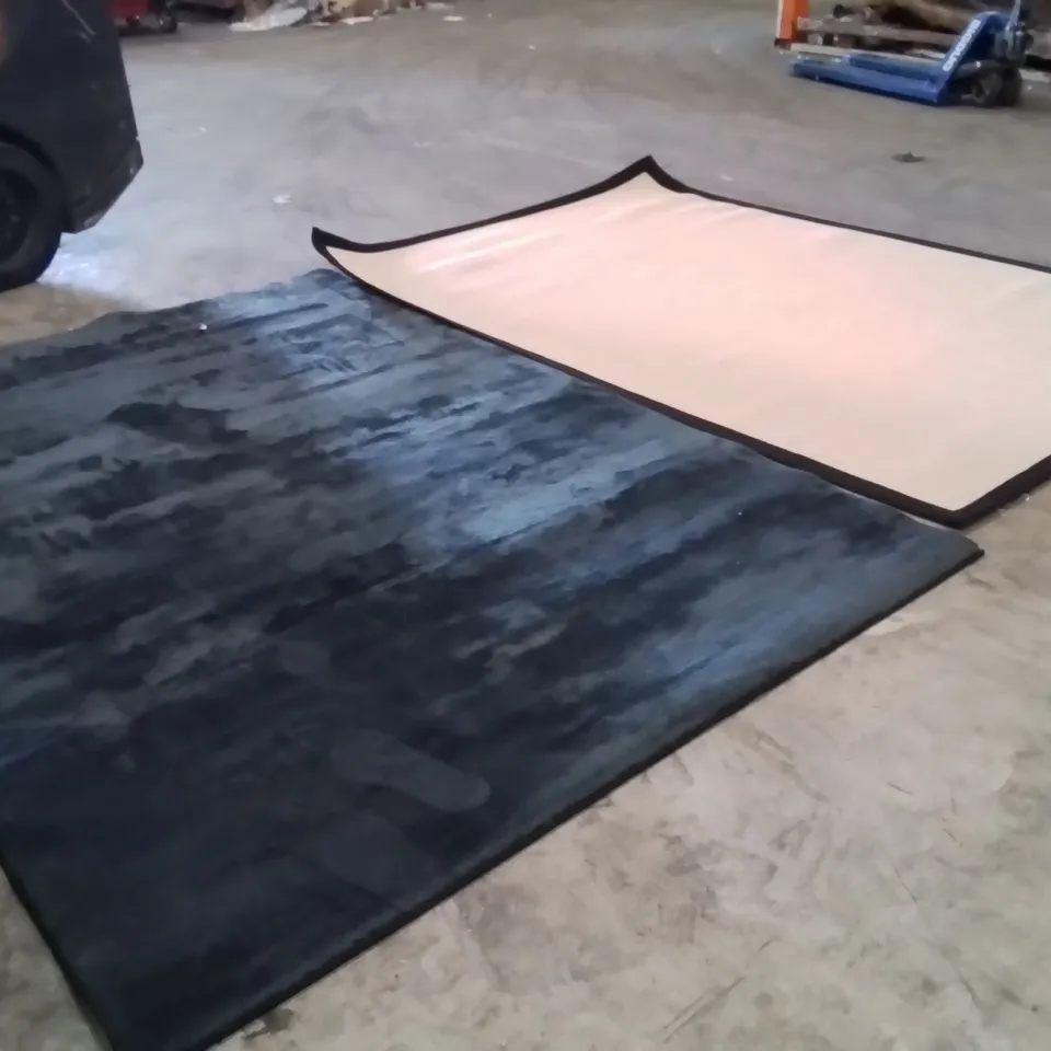 STILLAGE OF APPROXIMATELY 25 QUALITY DESIGNER RUGS