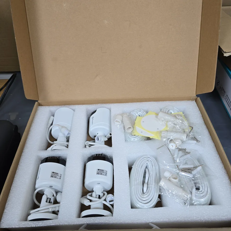 SWANN SECURITY CAMERA SYSTEM KIT – 4 CAMERAS WITH MOUNTS, CABLES AND POWER ADAPTERS