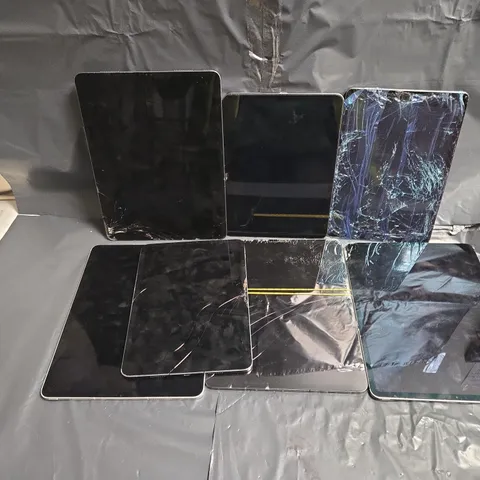 APPROXIMATELY 7 ASSORTED DAMAGED APPLE TABLETS IN VARIOUS MODELS & COLOURS