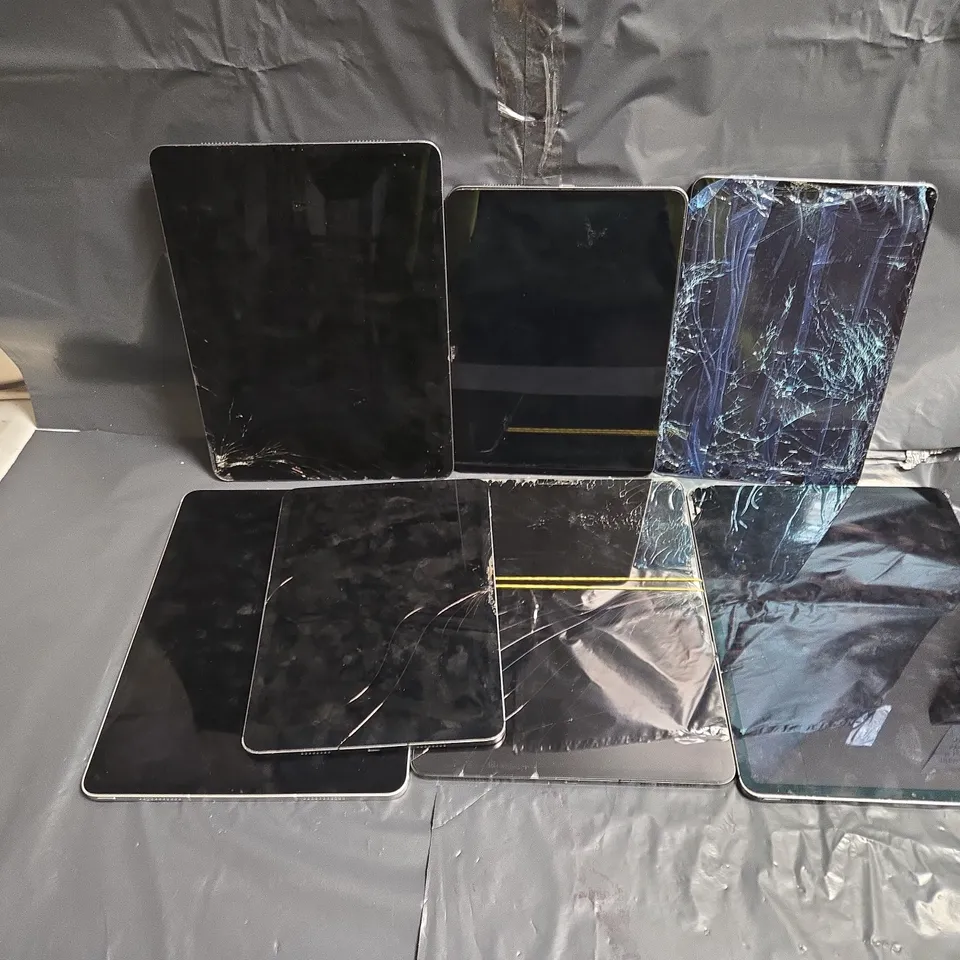 APPROXIMATELY 7 ASSORTED DAMAGED APPLE TABLETS IN VARIOUS MODELS & COLOURS