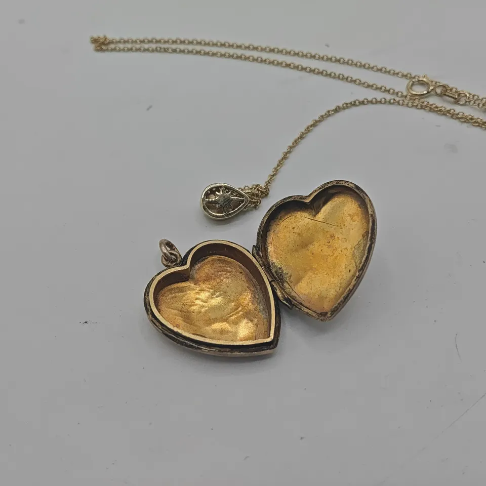 GOLD TONE NECKLACE WITH OPENING HEART PENDANT