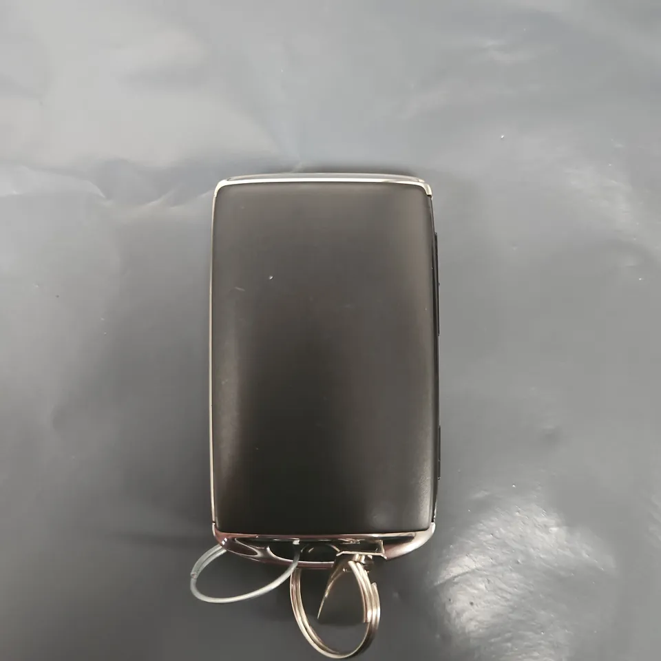 Mazda remote key fob with attached key rings