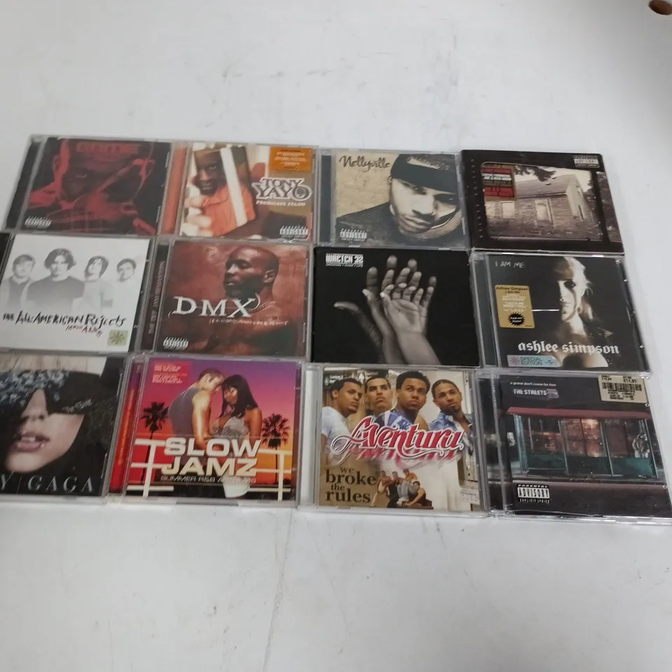 LOT OF APPROXIMATELY 35 ASSORTED CDS TO INCLUDE ASHLEE SIMPSON, EMINEM AND DMX