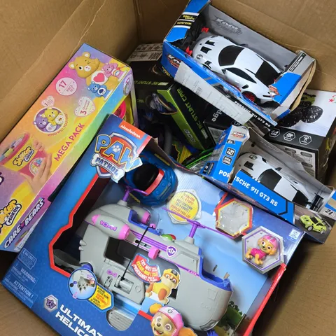 APPROXIMATELY 15 ASSORTED TOYS & GAMES PRODUCTS TO INCLUDE PAW PATROL ULTIMATE HELICOPTER, CARE BEARS SHAKER MAKER MEGA PACK, PORSCHE RC CAR, ETC