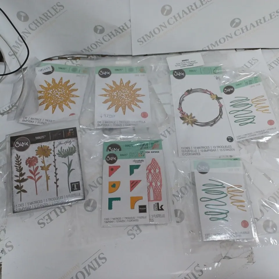 APPROXIMATELY 15 SIZZIX CRAFTING ITEMS TO INCLUDE THINLITS DIE, INKPAD, AND STAMP FRAMES ETC. 