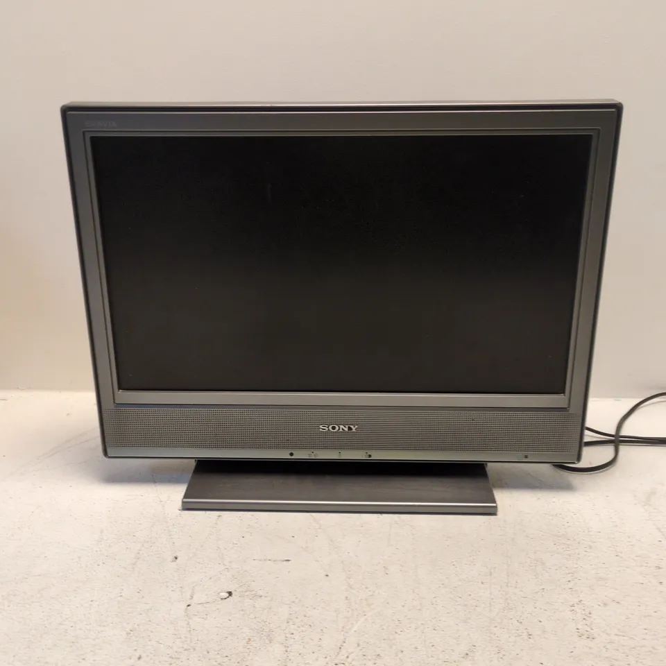 SONY BRAVIA FLAT-SCREEN TV/MONITOR – SILVER FRAME, ON STAND