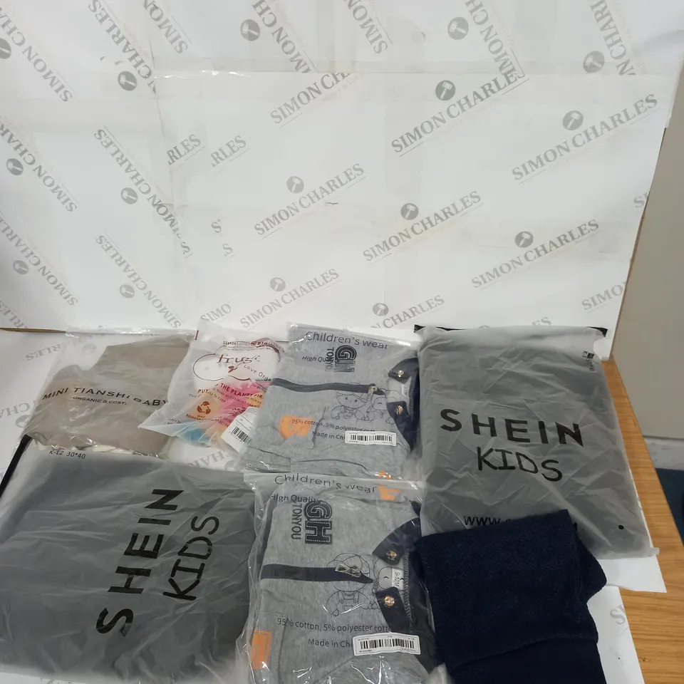 MEDIUM  BOX OF ASSORTED KIDS CLOTHING ITEMS TO INCLUDE BAGS, BABY GROWS AND DRESSES