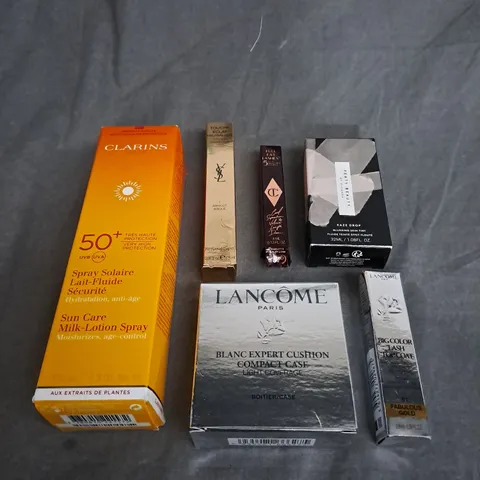 LOT OF 6 ASSORTED COSMETIC ITEMS TO INCLUDE - CLAIRINS SUN CARE MILK LOTION SPRAY - FENTY BEAUTY BLURRING SKIN TINT - LANCOME LASH TOP COAT IN FABULOUS GOLD  - ETC