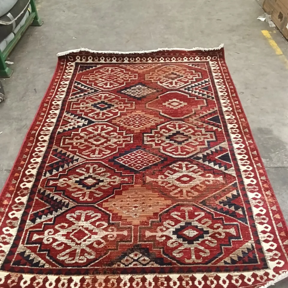 STILLAGE OF ASSORTED QUALITY RUGS APPROXIMATELY 32