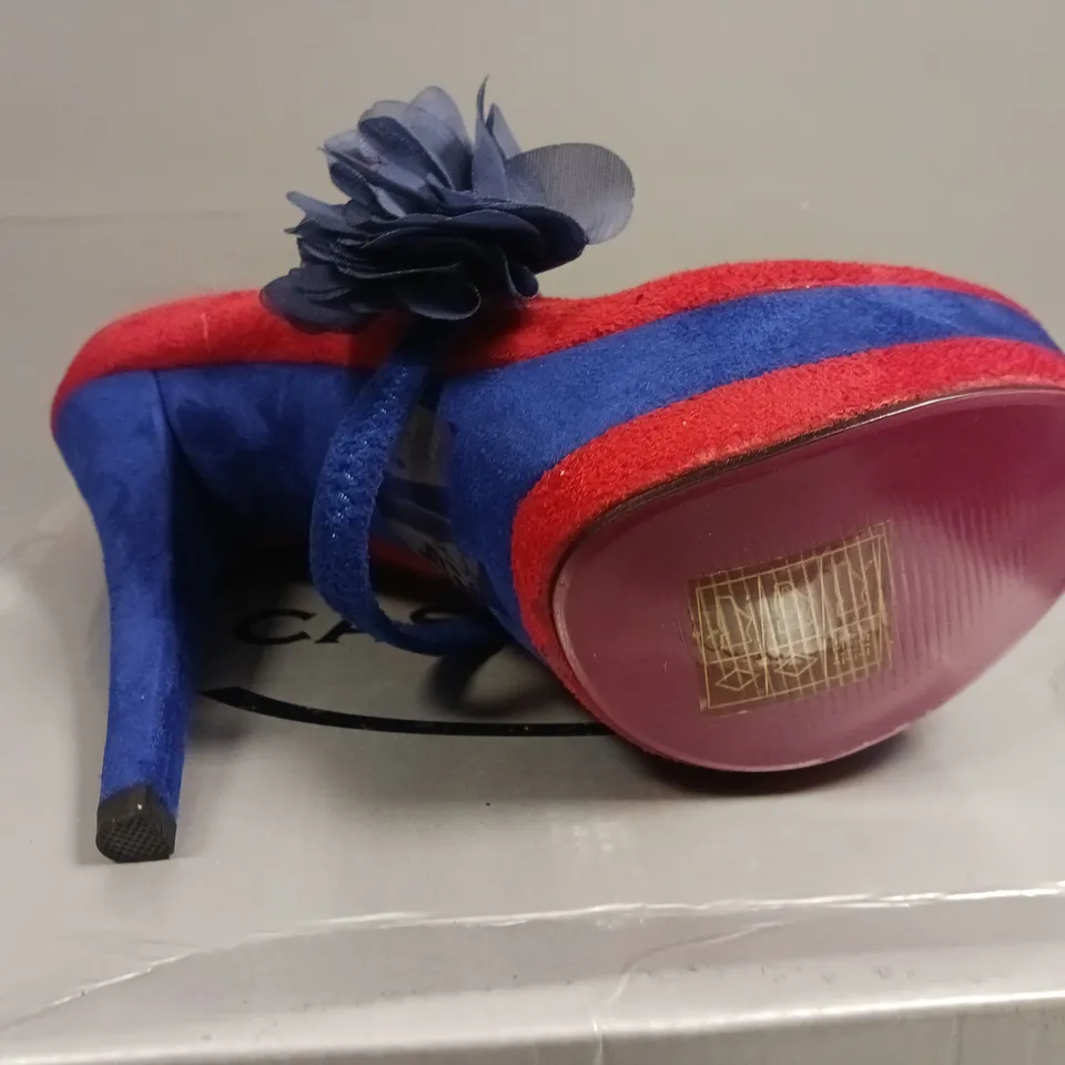 LOT OF 14 BOXED PAIRS OF CASANDRA RED/BLUE SHOES 