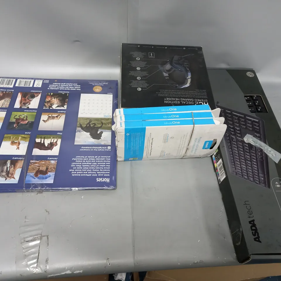 CAGE OF ASSORTED ITEMS TOO INCLUDE CALENDARS , HEADPHONES , GAMING KEYBOARDS AND PHONE CASES , ETC 