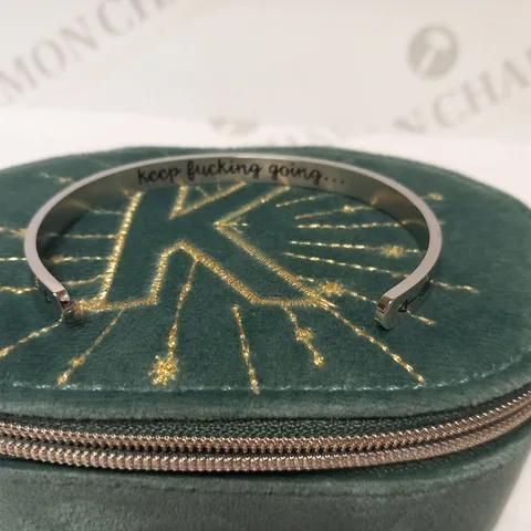 BRACELET INSCRIBED 'KEEP F***ING GOING'