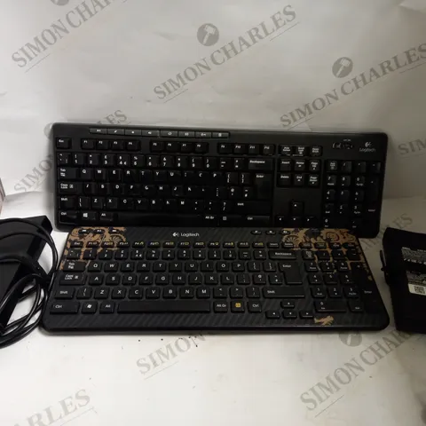 BOX OF 4 ITEMS INCLUDING 2 DELL AC ADAPTERS AND 2 LOGITECH WIRELESS KEYBOARDS